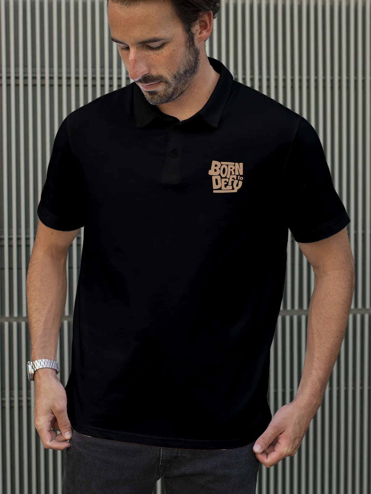 Model wearing Men's Black Polo T-shirt with Born To Defy, offering effortless style and premium comfort