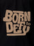 Close up of 'Born To Defy' design on Men's Black Polo T-shirt, highlighting intricate details and vibrant print.