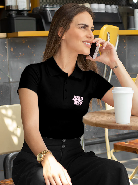 Fighterhero Polos: Model wearing Women's Black Polo T-shirt with 'Born To Defy' design