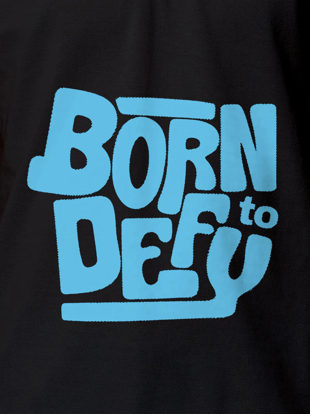 Close up of 'Born To Defy' design on Men's Dark Grey Polo T-shirt, highlighting intricate details and vibrant print.