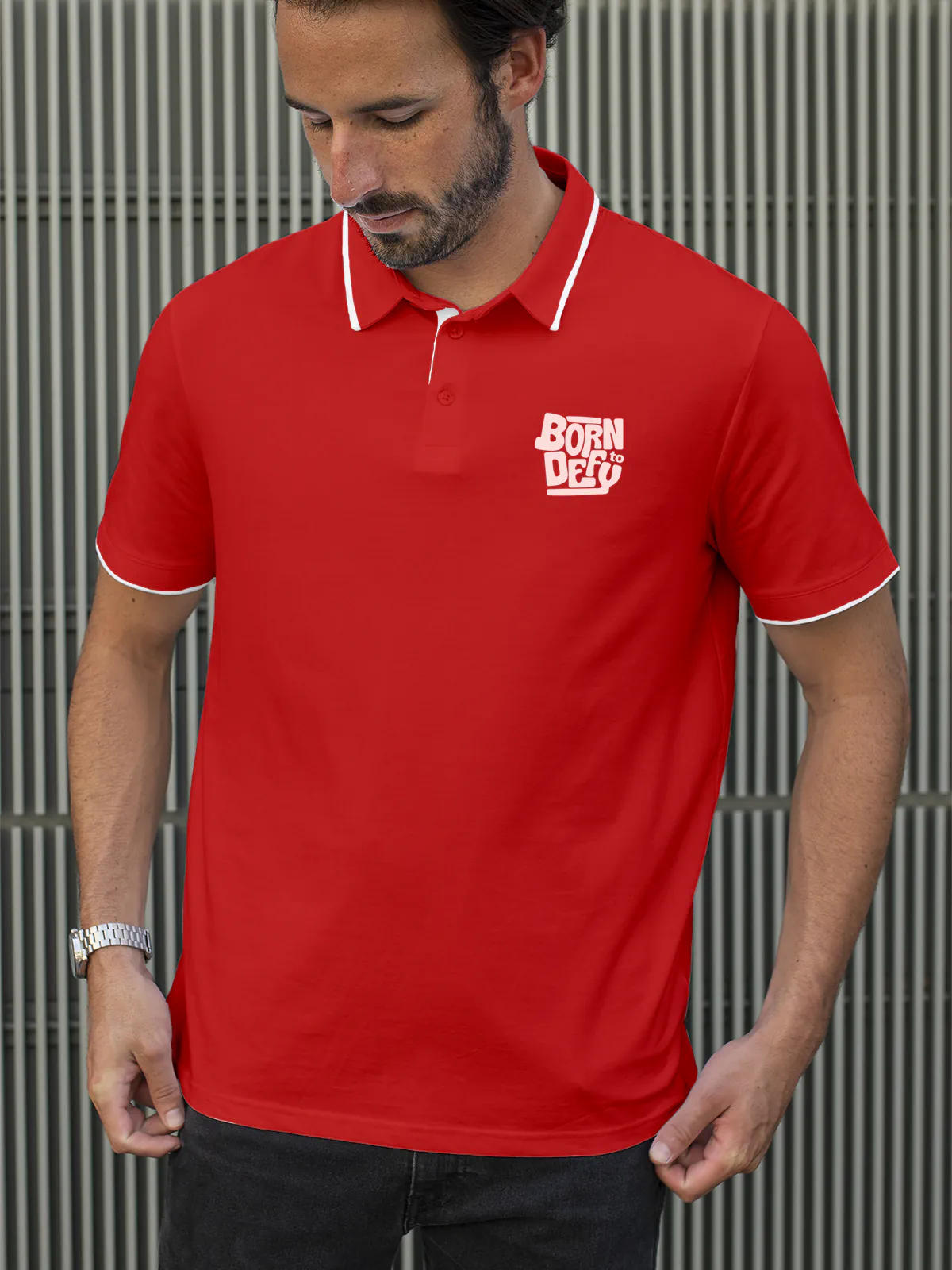 Model wearing Men's Red Polo T-shirt with 'Born To Defy' design, offering effortless style and premium comfort