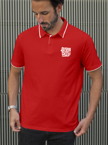 Model wearing Men's Red Polo T-shirt with 'Born To Defy' design, offering effortless style and premium comfort