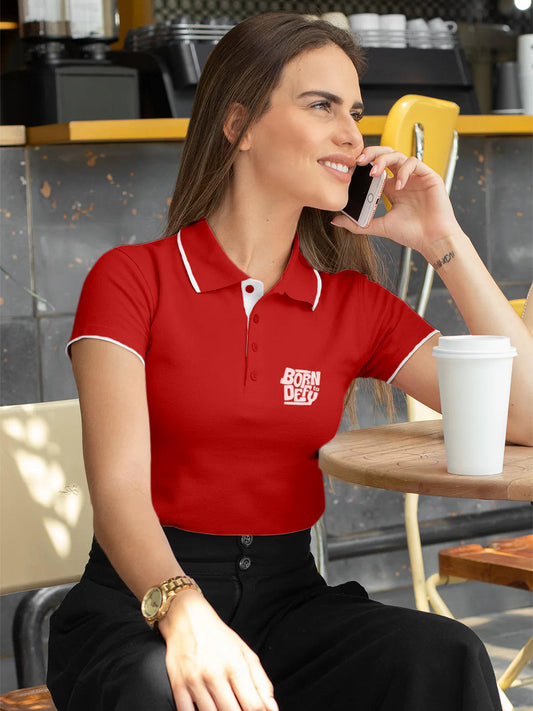 Model wearing Women's Red Polo T-shirt with 'Born To Defy' design, offering effortless style and premium comfort