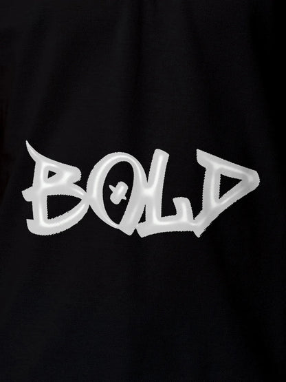 Close up of 'Bold' on Men's Black Polo T-shirt, highlighting intricate details and vibrant print.
