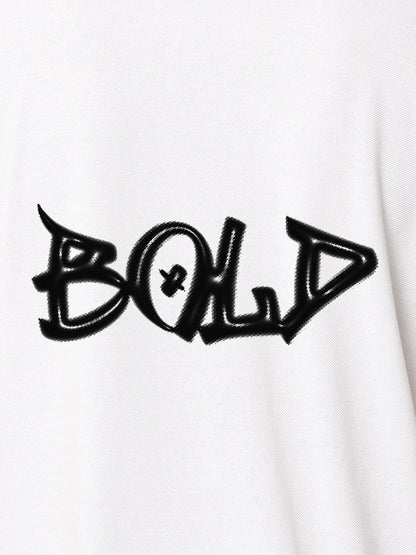 Close up of 'Bold' on Women's White Polo T-shirt, highlighting intricate details and vibrant print.