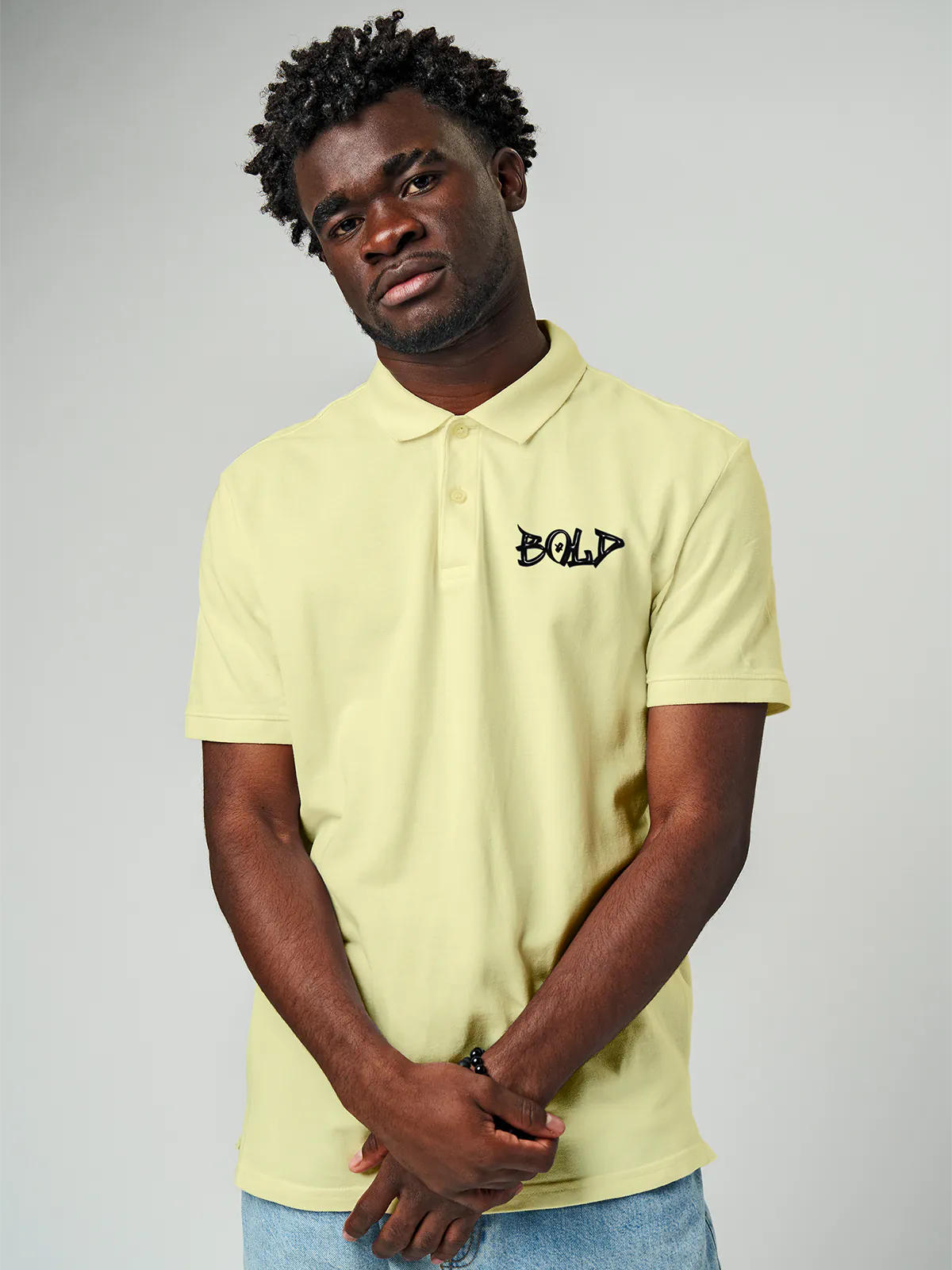Model wearing Men's Yellow Polo T-shirt with Bold, offering effortless style and premium comfort