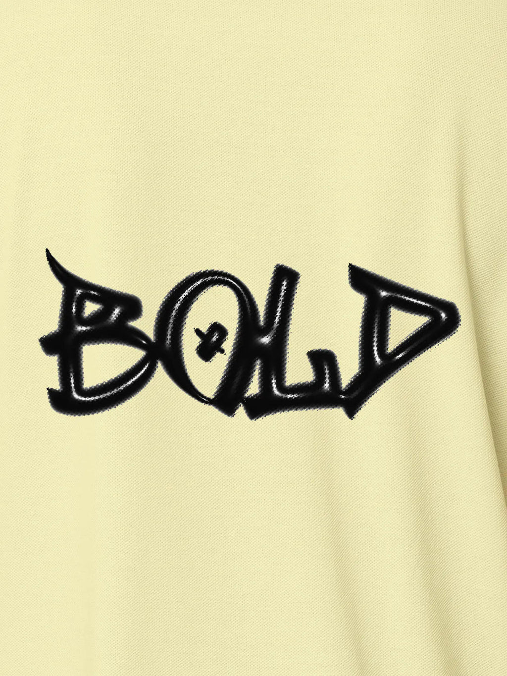 Close up of 'Bold' on Women's Yellow Polo T-shirt, highlighting intricate details and vibrant print.