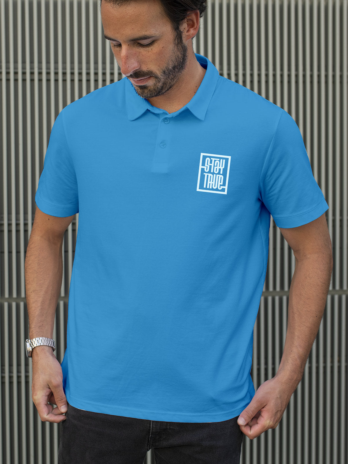 Fighterhero Polos: Model wearing Men's Blue Polo T-shirt with 'Stay True' design