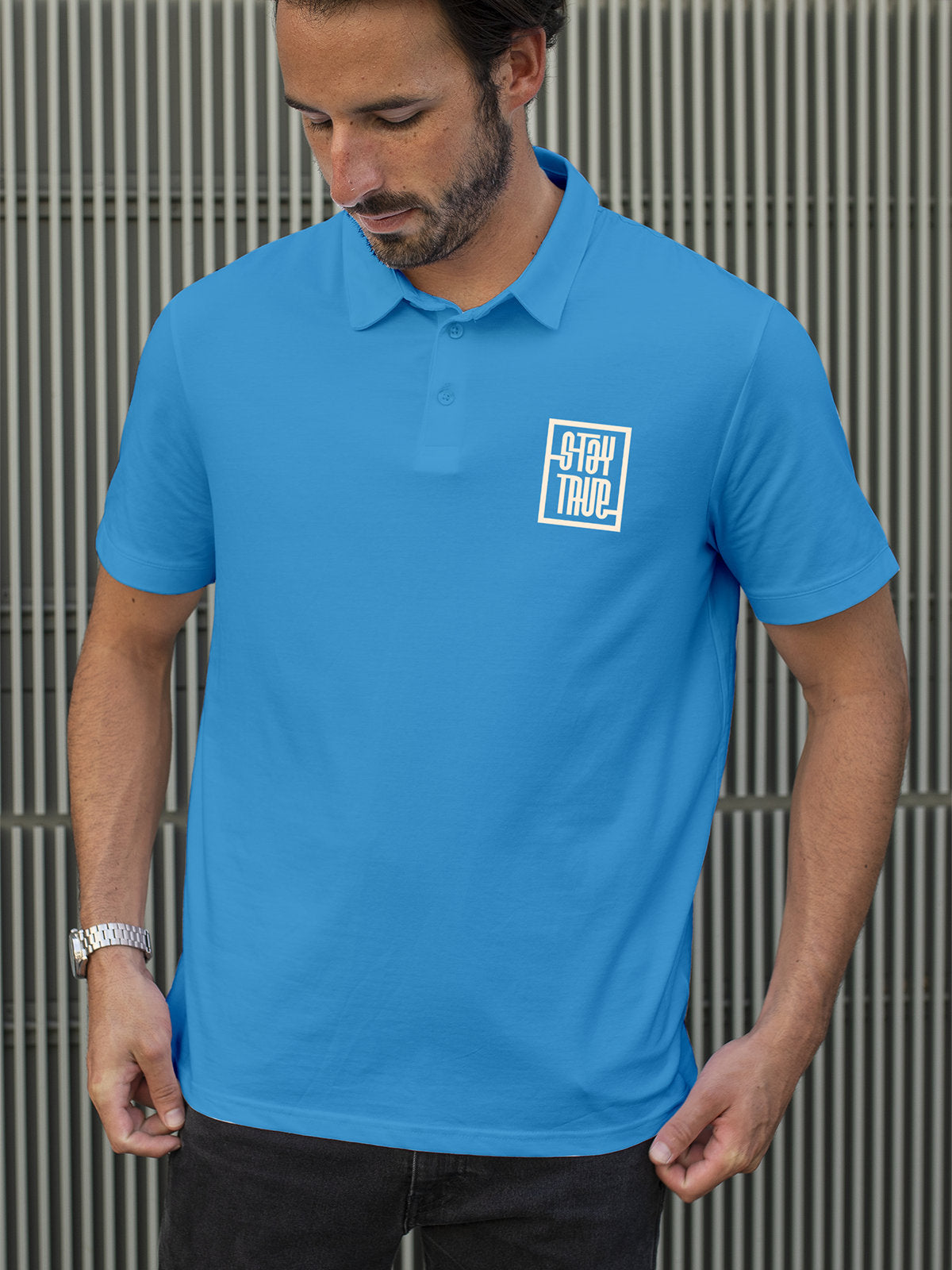 Model wearing Men's Blue Polo T-shirt with Stay True, offering effortless style and premium comfort