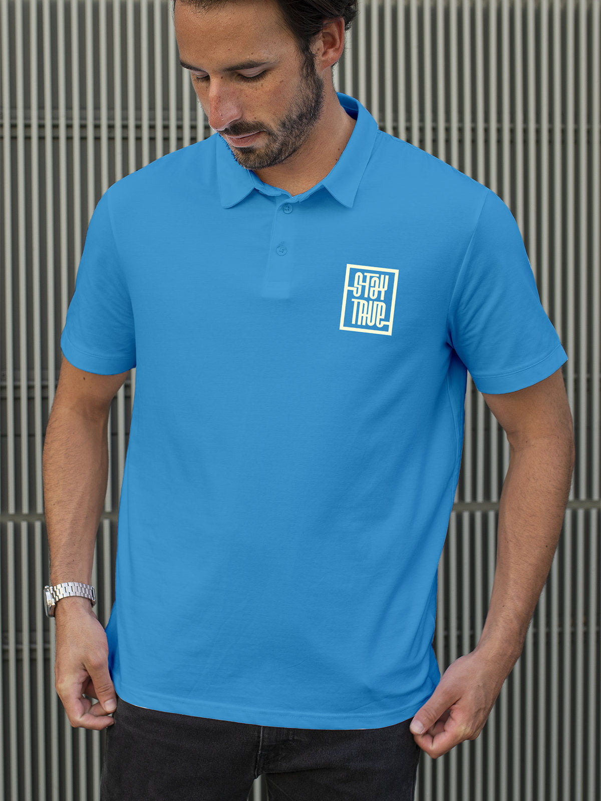 Model wearing Men's Blue Polo T-shirt with Stay True, offering effortless style and premium comfort