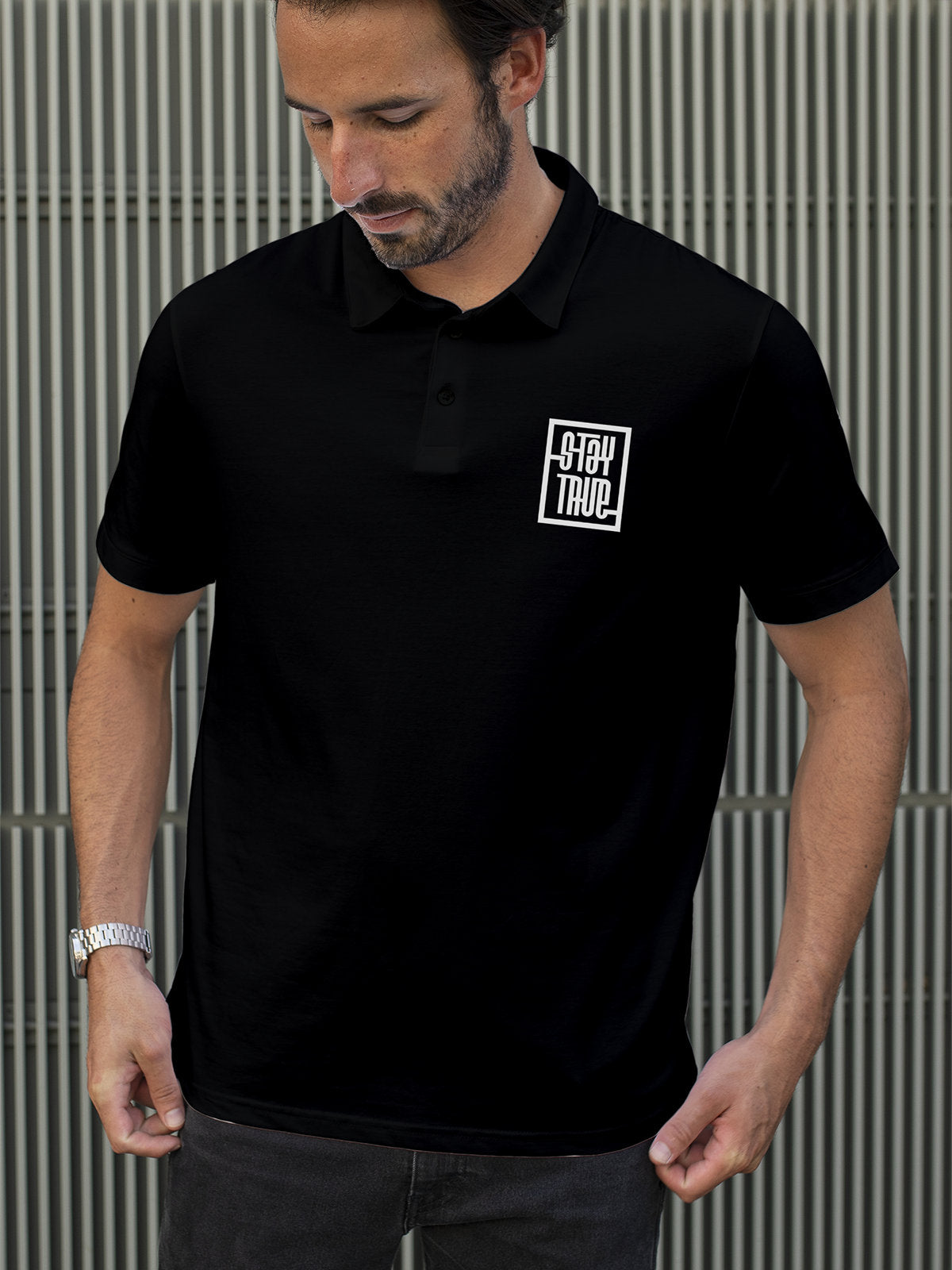 Model wearing Men's Black Polo T-shirt with Stay True, offering effortless style and premium comfort