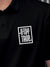 Close up of 'Stay True' design on Men's Black Polo T-shirt, highlighting intricate details and vibrant print.