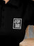 Close up of 'Stay True' design on Women's Black Polo T-shirt, highlighting intricate details and vibrant print.