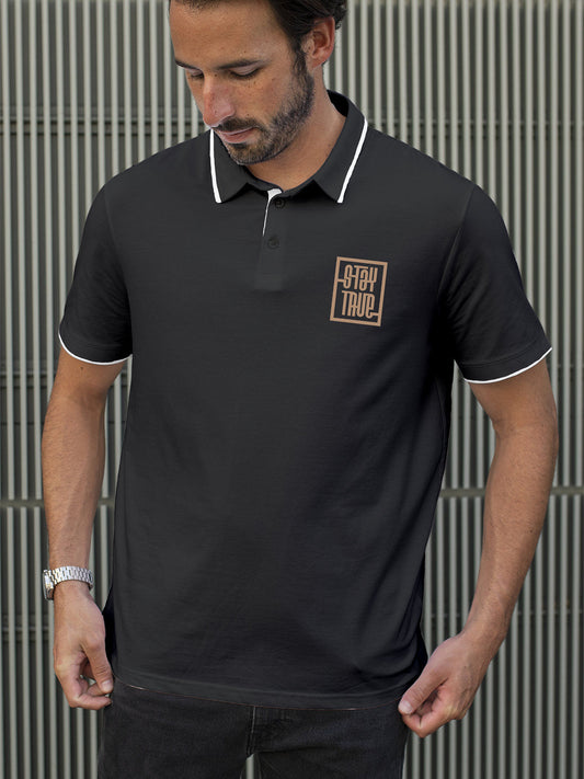 Model wearing Men's Dark Grey Polo T-shirt with 'Stay True' design, offering effortless style and premium comfort