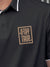 Close up of 'Stay True' design on Men's Dark Grey Polo T-shirt, highlighting intricate details and vibrant print.