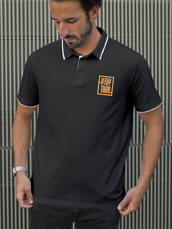 Fighterhero Polos: Model wearing Men's Dark Grey Polo T-shirt with 'Stay True' design