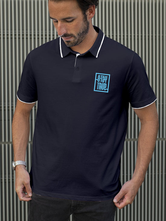 Fighterhero Polos: Model wearing Men's Navy Blue Polo T-shirt with 'Stay True' design