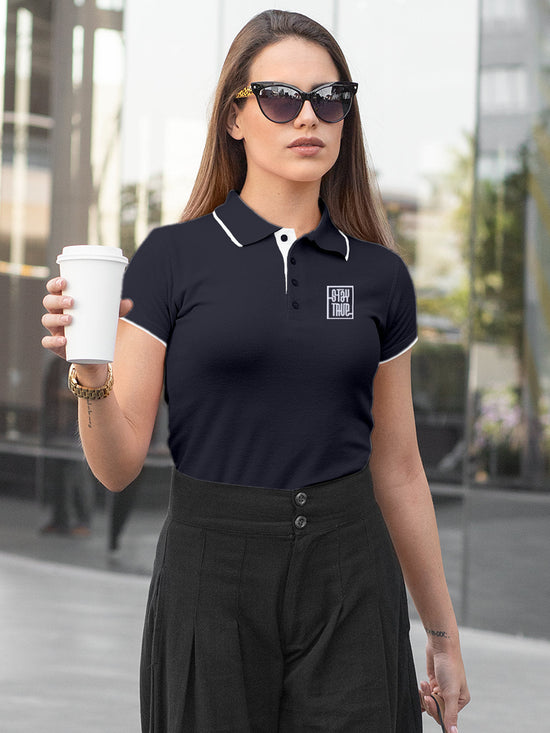 Fighterhero Polos: Model wearing Women's Navy Blue Polo T-shirt with 'Stay True' design