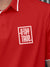 Close up of 'Stay True' design on Men's Red Polo T-shirt, highlighting intricate details and vibrant print.