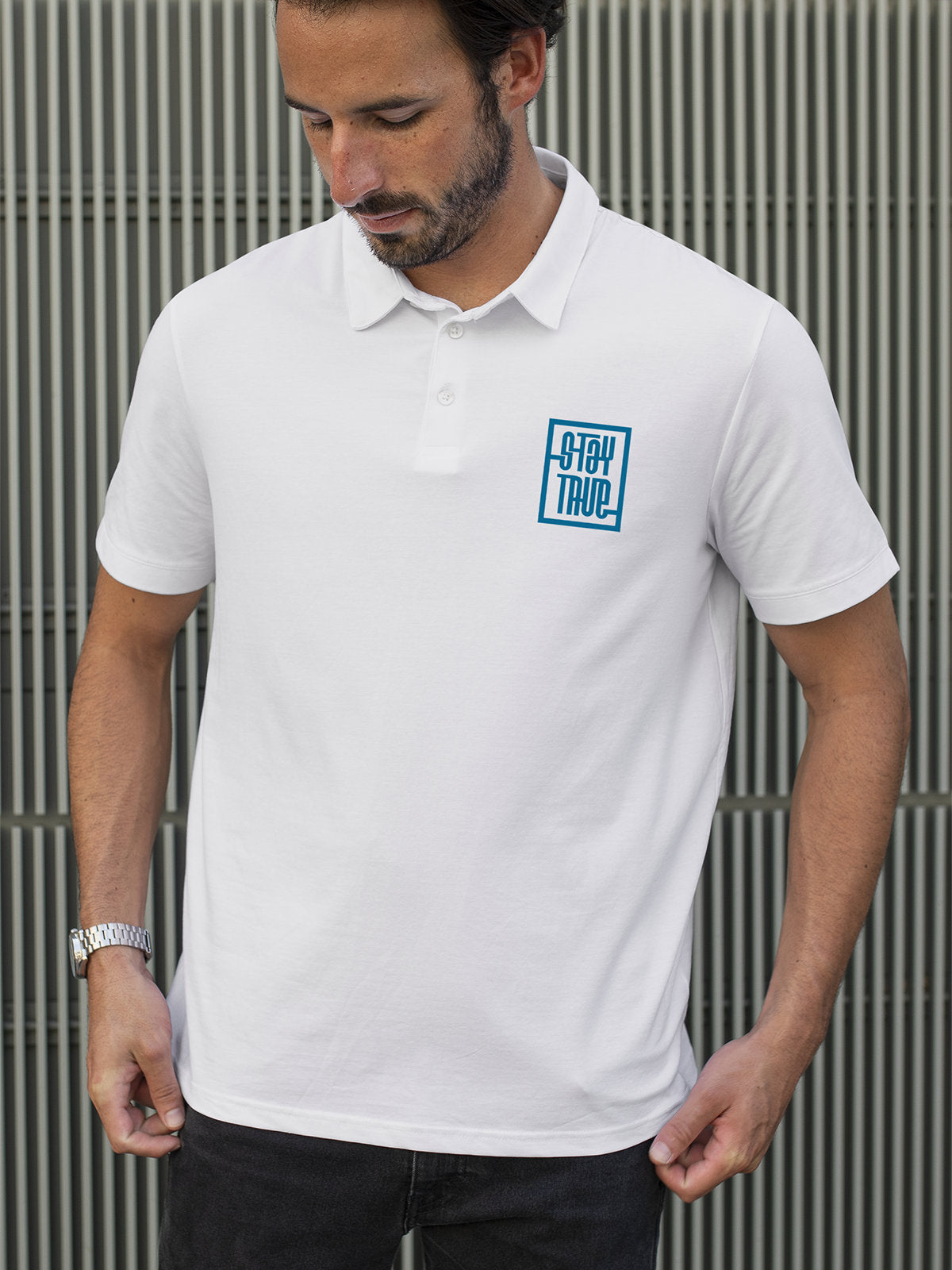 Model wearing Men's White Polo T-shirt with Stay True, offering effortless style and premium comfort