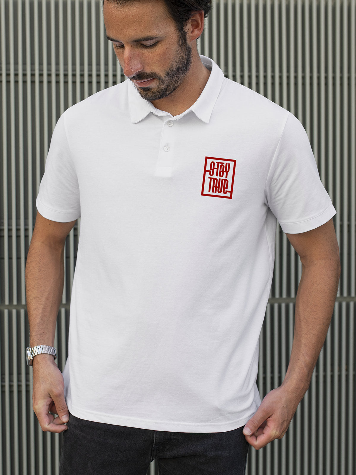 Model wearing Men's White Polo T-shirt with Stay True, offering effortless style and premium comfort