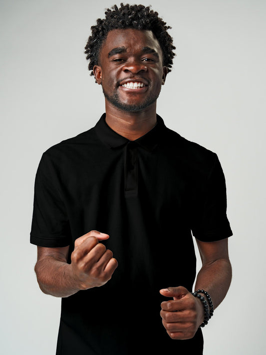 Model wearing Men's Plain Solid Black Polo T-shirt, offering effortless style and premium comfort