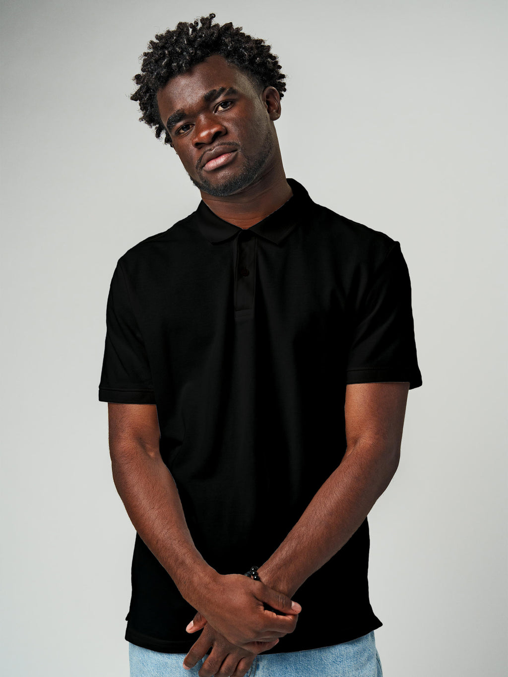 Close up of Men's Plain Solid Black Polo T-shirt, showing intricate details and texture