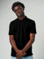 Close up of Men's Plain Solid Black Polo T-shirt, showing intricate details and texture