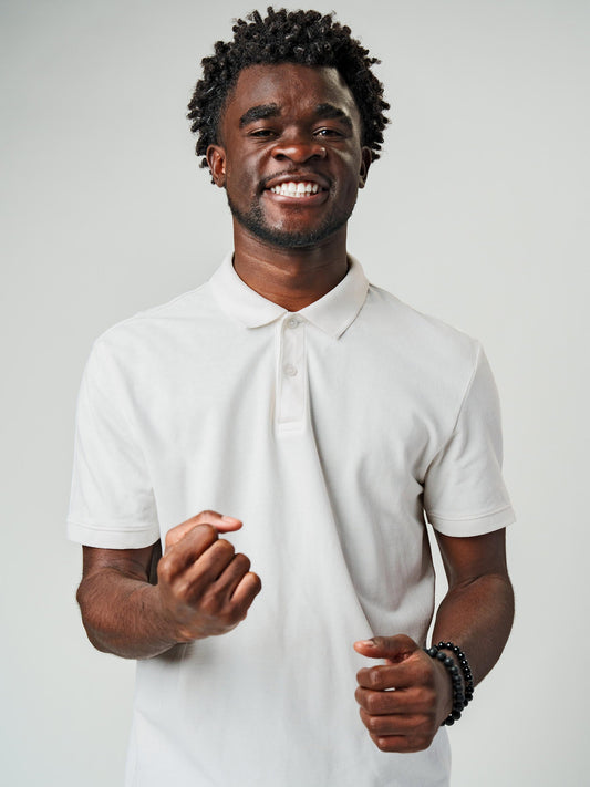 Model wearing Men's Plain Solid White Polo T-shirt, offering effortless style and premium comfort