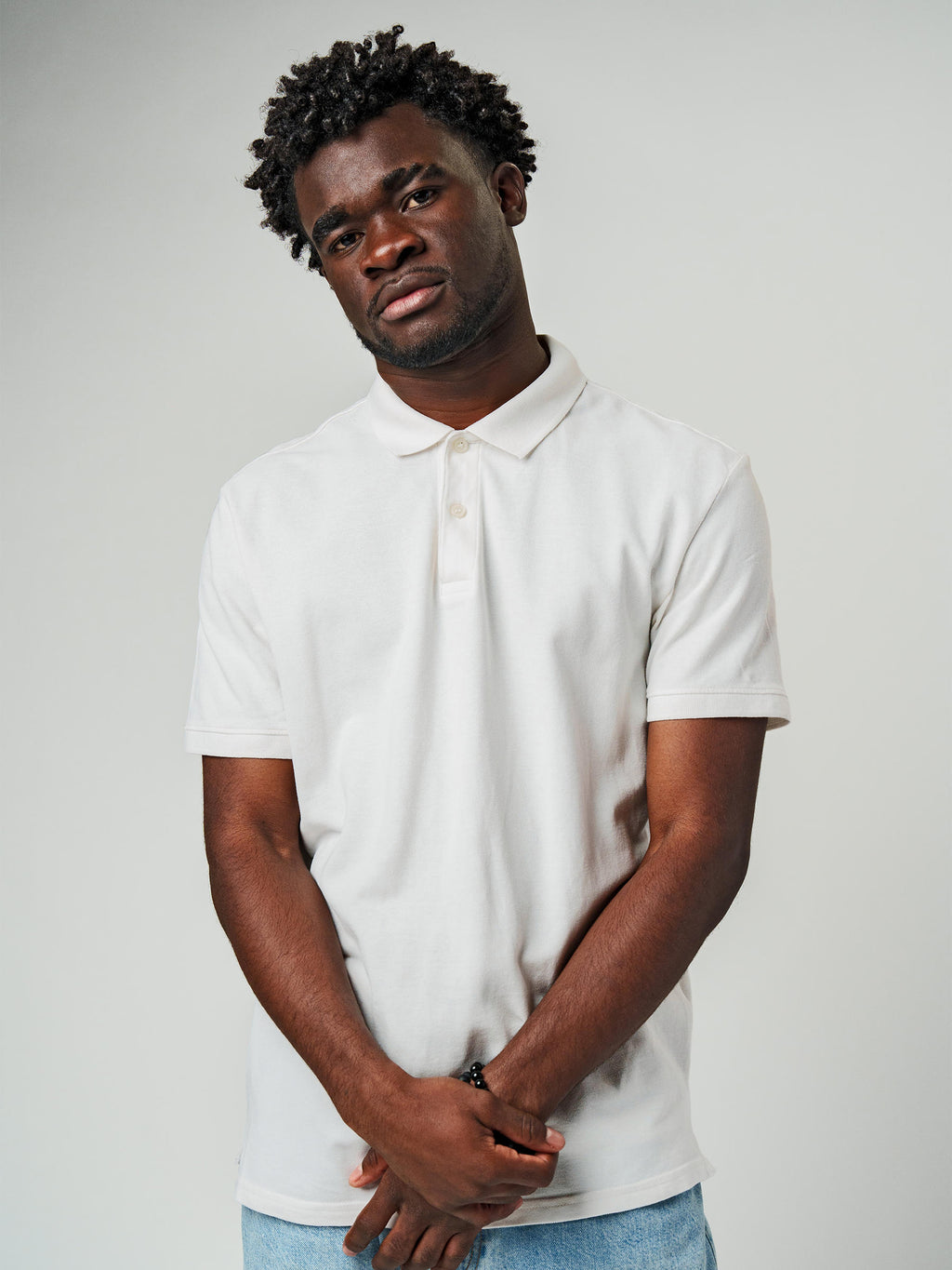 Close up of Men's Plain Solid White Polo T-shirt, showing intricate details and texture