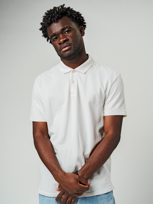 Model wearing Men's Plain Solid White Polo T-shirt, offering effortless style and premium comfort