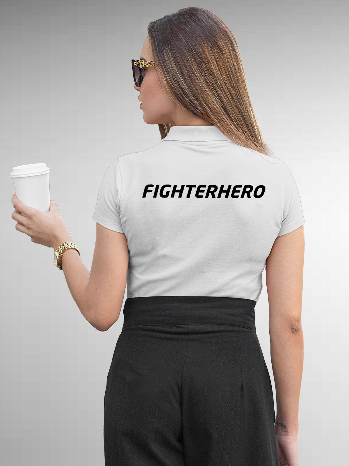 Model wearing Women's White Polo T-shirt with 'Fighterhero' design, offering effortless style and premium comfort