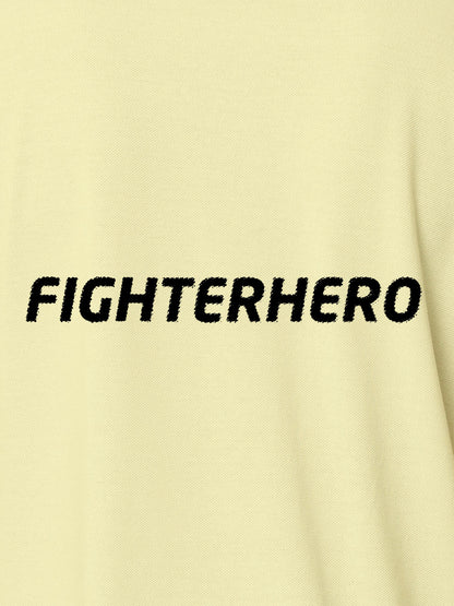 Close up of 'Fighterhero' design on Men's Yellow Polo T-shirt, highlighting intricate details and vibrant print.