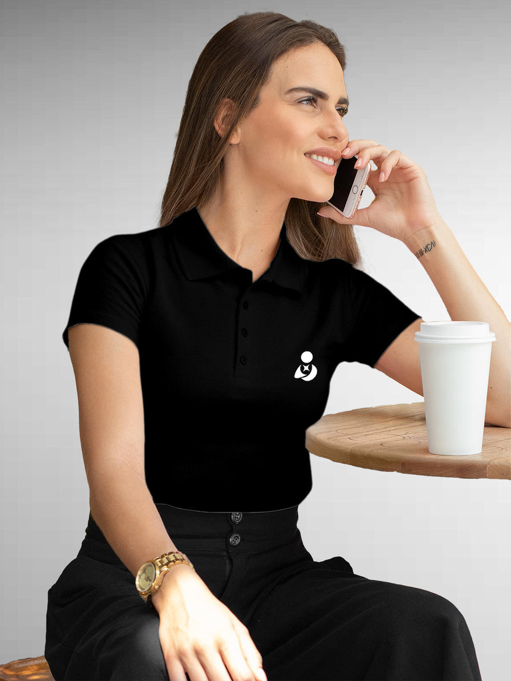 Model wearing Women's Black Polo T-shirt with Fighterhero Logo, offering effortless style and premium comfort
