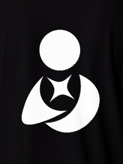 Close up of 'Fighterhero Logo' on Women's Black Polo T-shirt, highlighting intricate details and vibrant print.