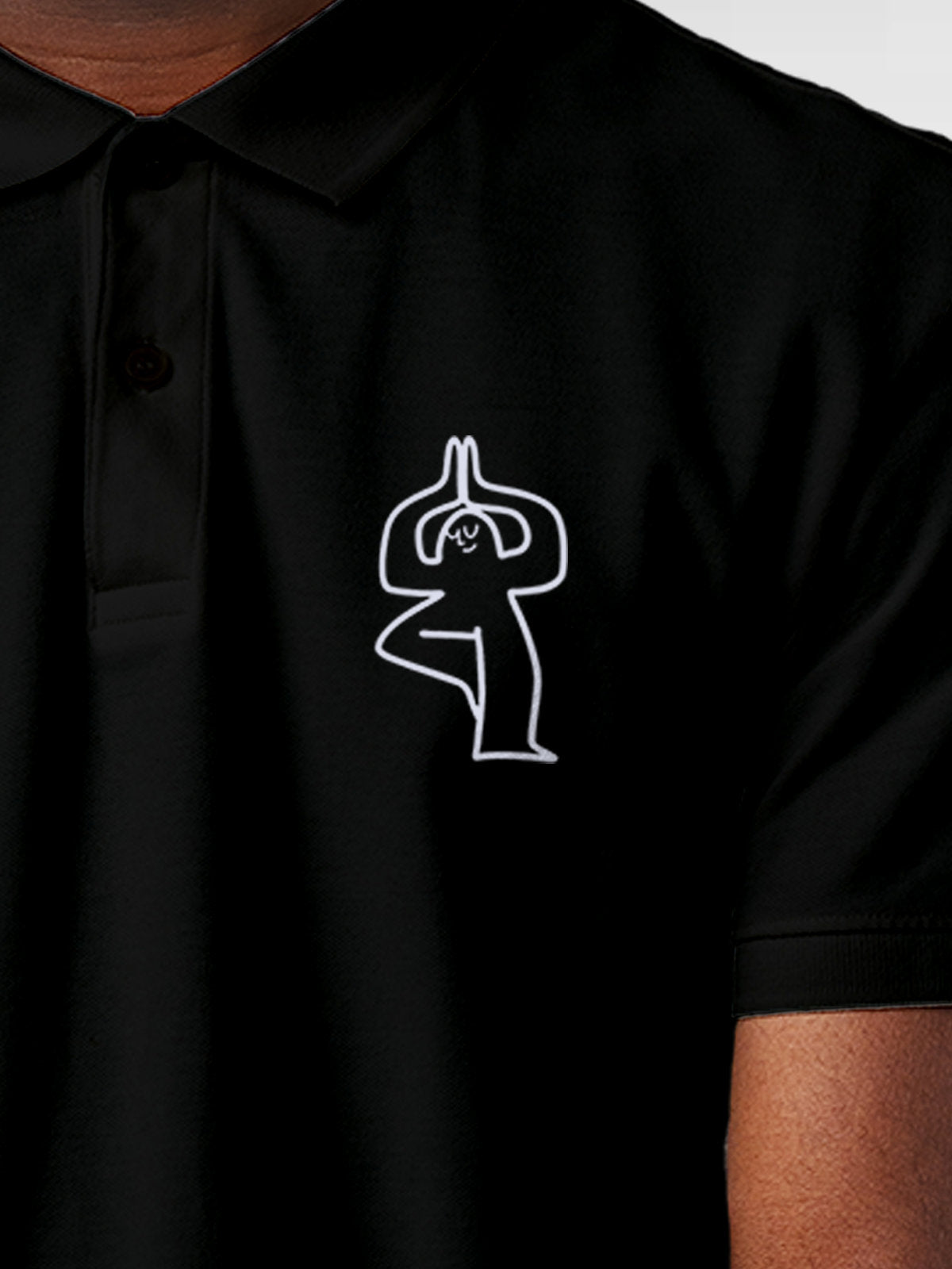 Close up of 'Balance Is A Decision' design on Men's Black Collar T-shirt, highlighting intricate details and vibrant print.