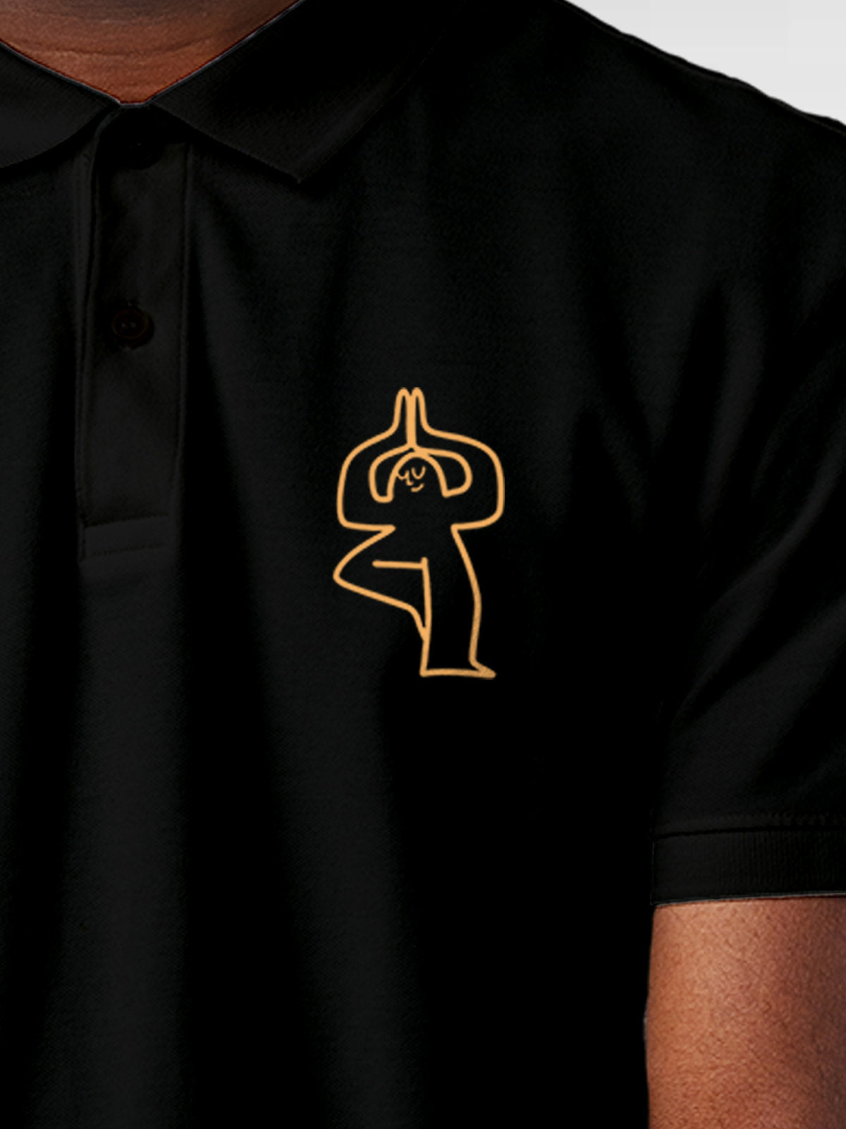 Close up of 'Balance Is A Decision' design on Men's Black Collar T-shirt, highlighting intricate details and vibrant print.