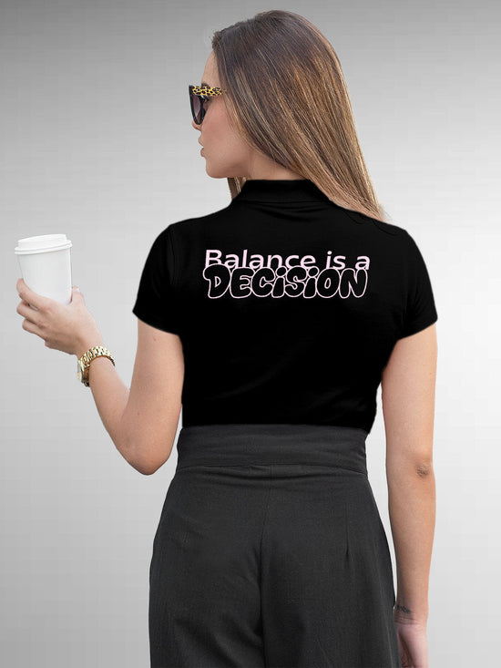 Fighterhero Polos: Model wearing Women's Black Polo T-shirt with 'Balance Is A Decision' design