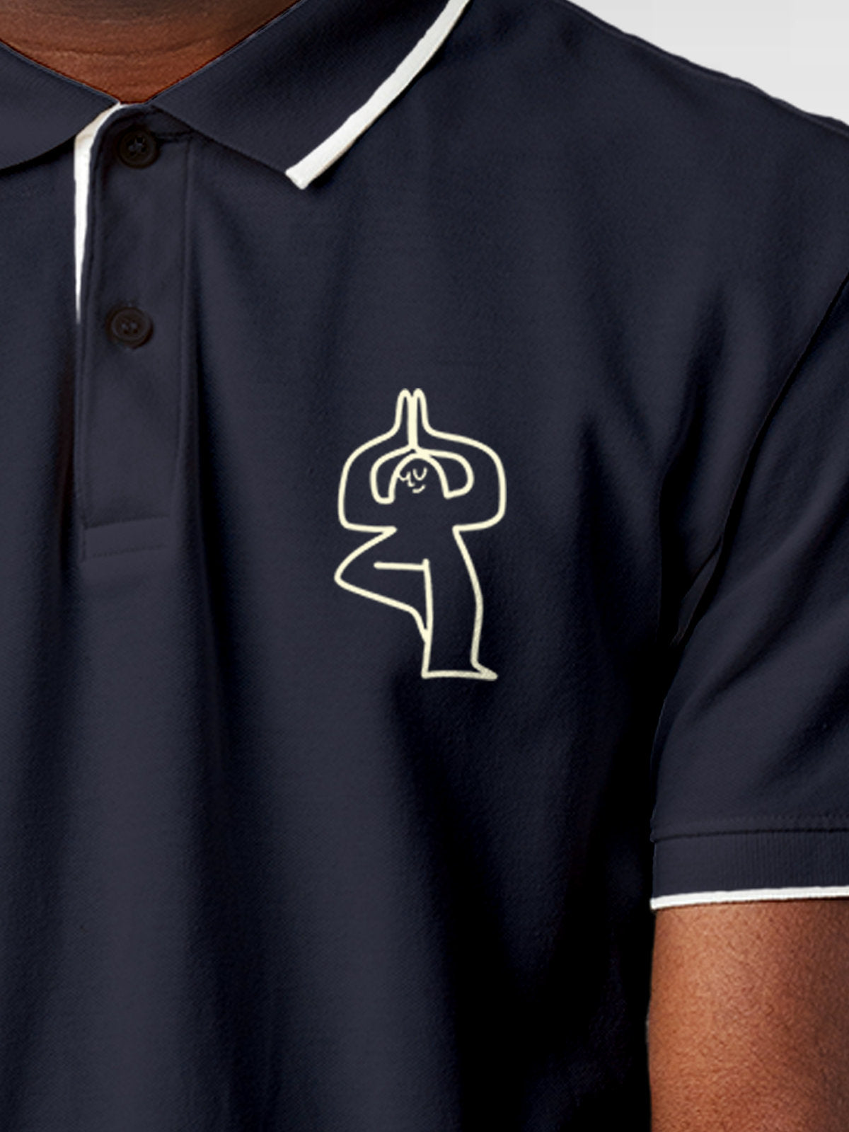 Close up of 'Balance Is A Decision' design on Men's Navy Blue Collar T-shirt, highlighting intricate details and vibrant print.