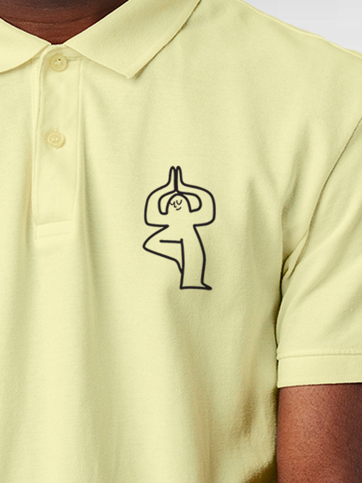 Close up of 'Balance Is A Decision' design on Men's Yellow Collar T-shirt, highlighting intricate details and vibrant print.