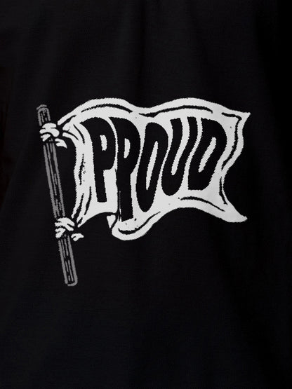 Close up of 'Proud' design on Women's Black Polo T-shirt, highlighting intricate details and vibrant print.