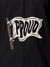 Close up of 'Proud' design on Women's Dark Grey Polo T-shirt, highlighting intricate details and vibrant print.