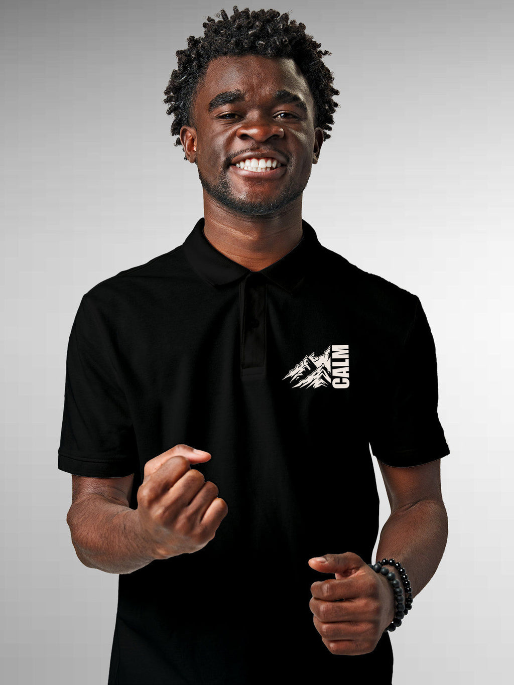 Model wearing Men's Black Polo T-shirt with 'Calm' design, offering effortless style and premium comfort
