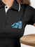 Close up of 'Calm' design on Women's Dark Grey Polo T-shirt, highlighting intricate details and vibrant print.