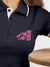 Close up of 'Calm' design on Women's Navy Blue Polo T-shirt, highlighting intricate details and vibrant print.