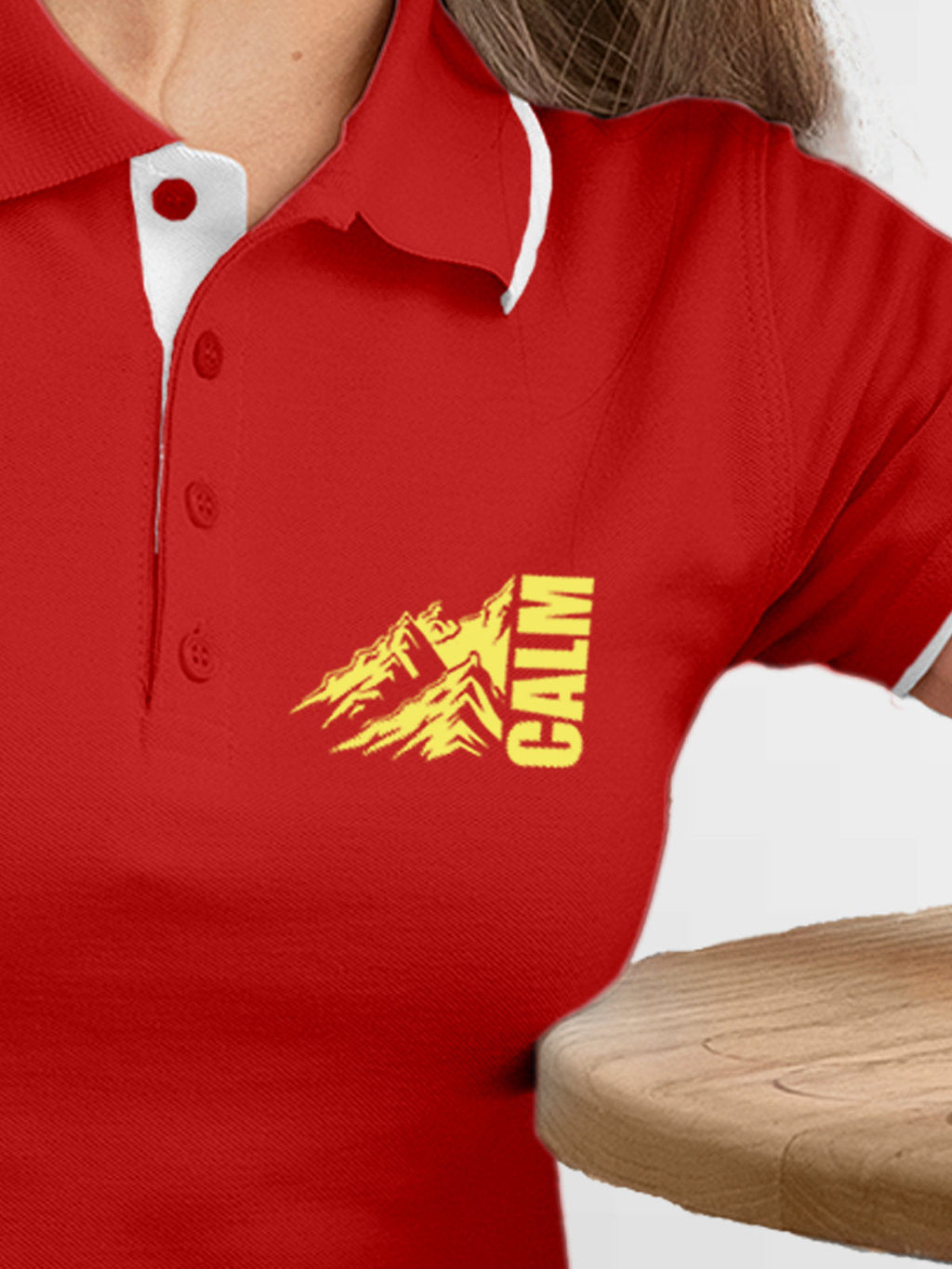 Close up of 'Calm' design on Women's Red Polo T-shirt, highlighting intricate details and vibrant print.