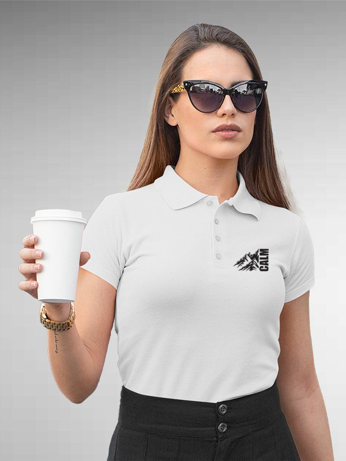 Model wearing Women's White Polo T-shirt with 'Calm' design, offering effortless style and premium comfort