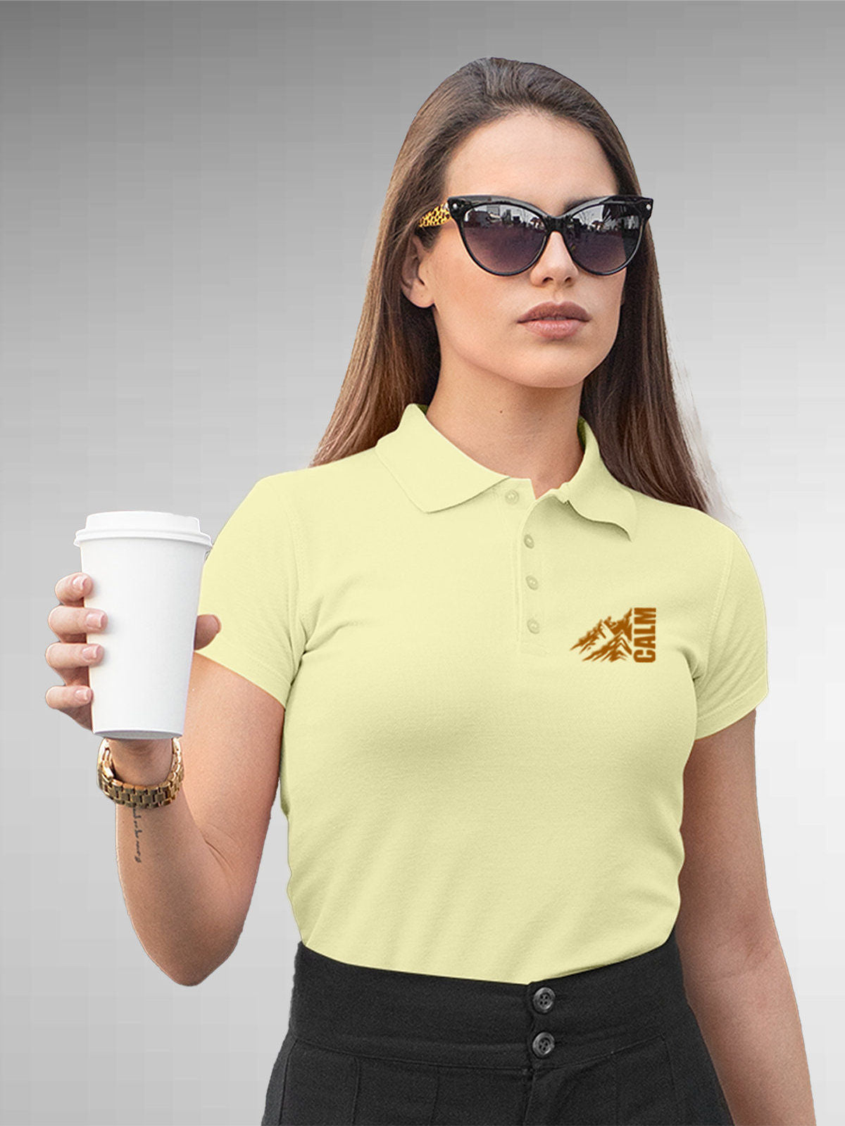 Model wearing Women's Yellow Polo T-shirt with 'Calm' design, offering effortless style and premium comfort