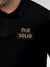 Close up of 'Still Solid' design on Men's Black Polo T-shirt, highlighting intricate details and vibrant print.