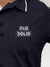 Close up of 'Still Solid' design on Women's Navy Blue Polo T-shirt, highlighting intricate details and vibrant print.